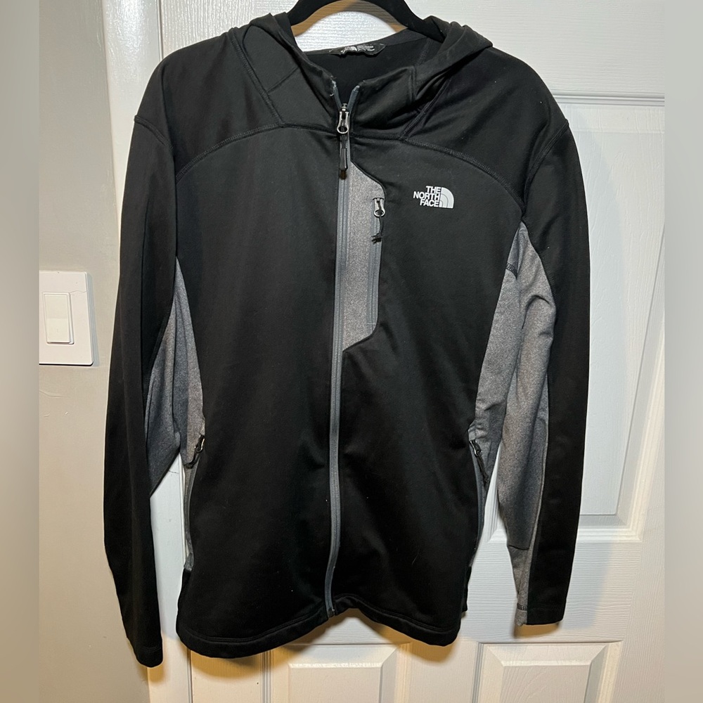 The north Face full zip light weight jacket with hood.